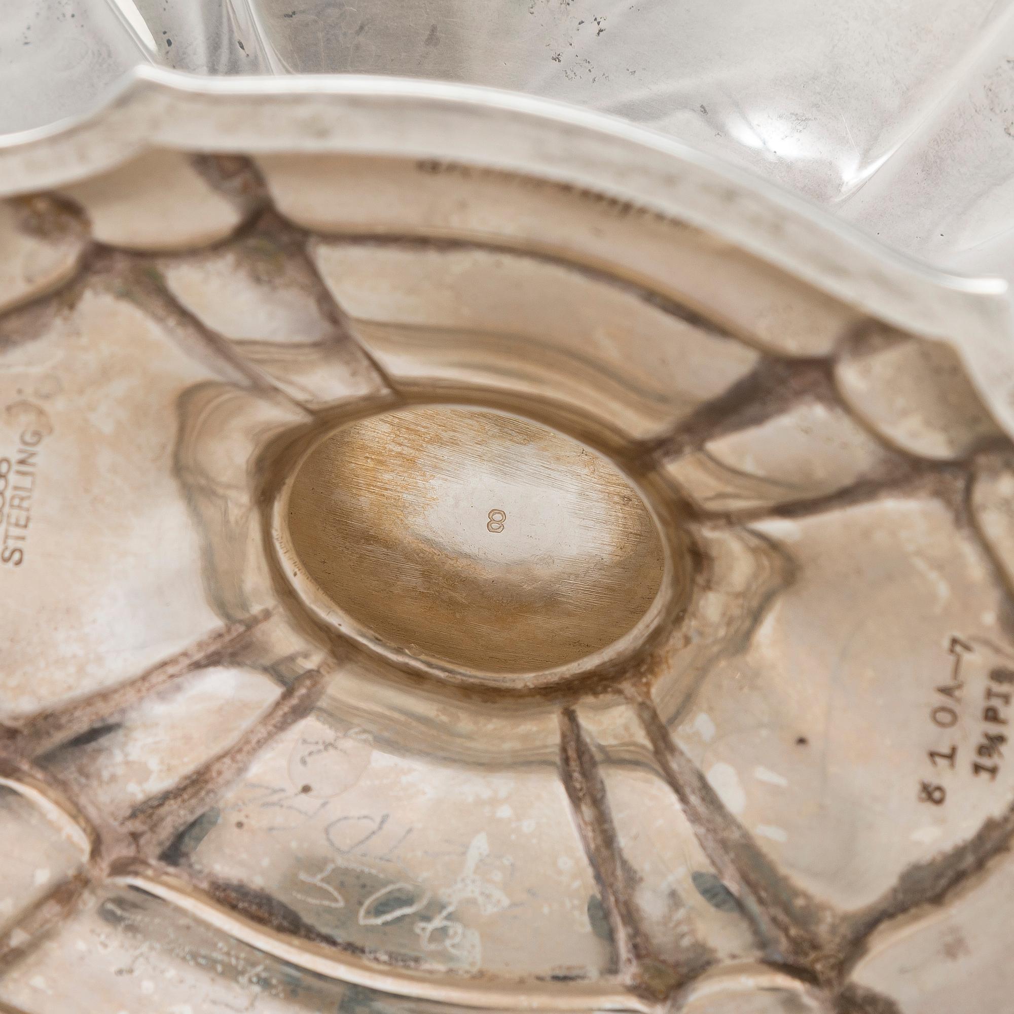 A five-piece sterling silver coffee and tea service, and 12 spoons, USA, first quarter of the 20th century.