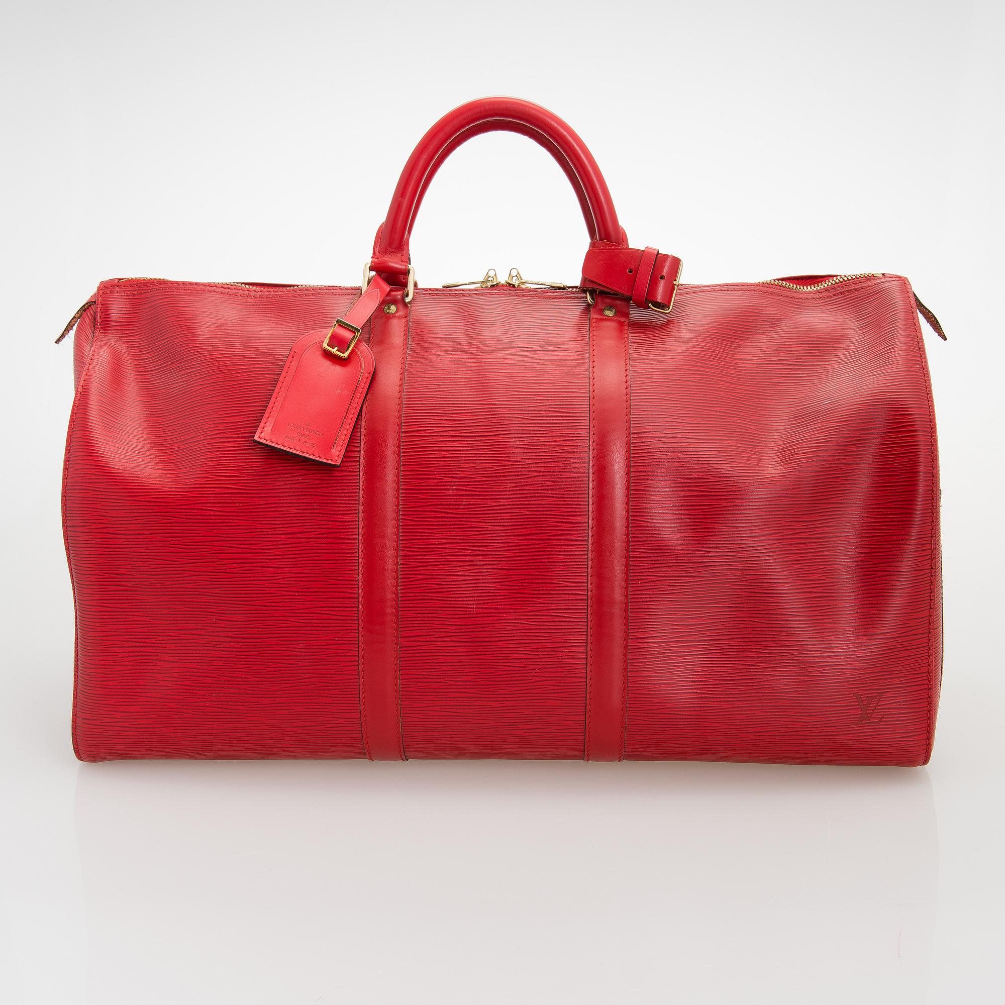 Louis Vuitton, A Red Epi Leather Keepall travel bag.
