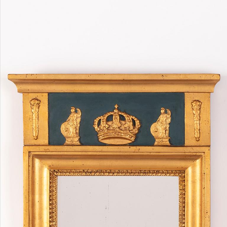 An Empire style mirror from around the year 1900.