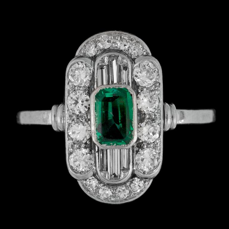 An art déco ring with diamonds and green stone.
