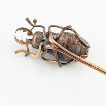 A brooch pin in the form of a beetle, 18K gold and silver with labradorite.