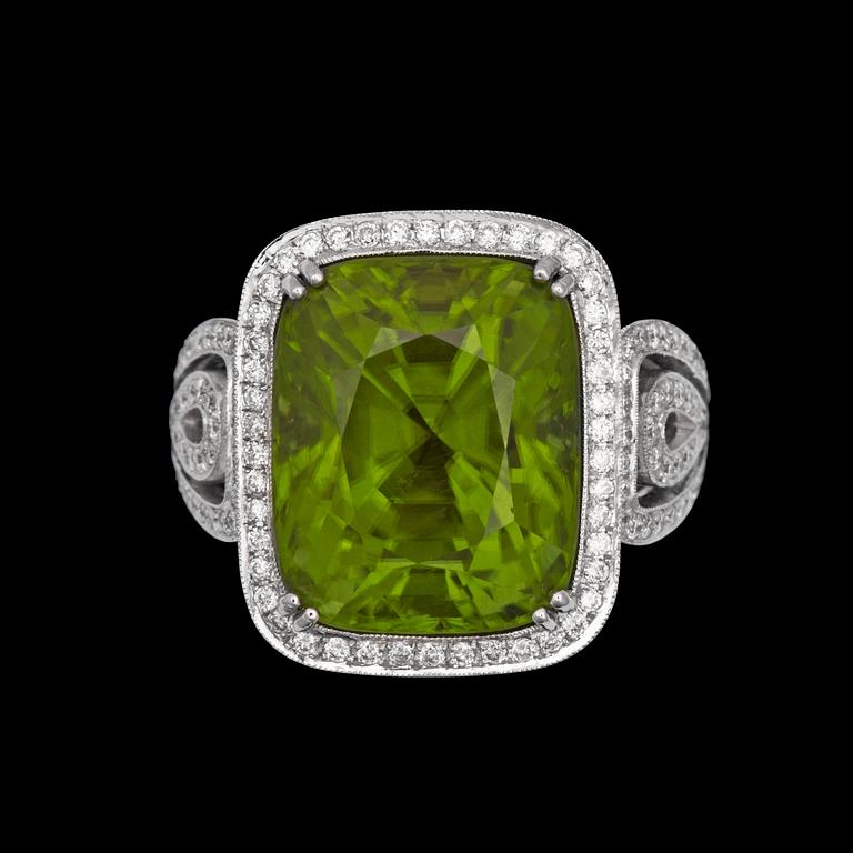 A peridote, 15.98 ct and diamond tot. app. 0.98 cts, ring.