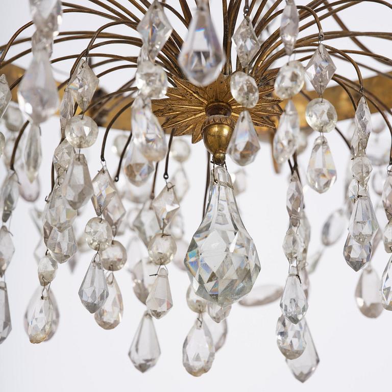 A Late gustavian green top glass six light chandelier.