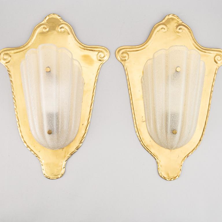 A pair of brass and glass wall lamps, 1940s.