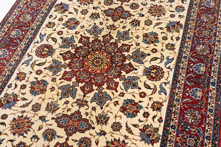 A semi-antique Isfahan rug, c. 225 x 143 cm.