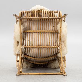 A Scandinavian cane armchair, mid 20th century.