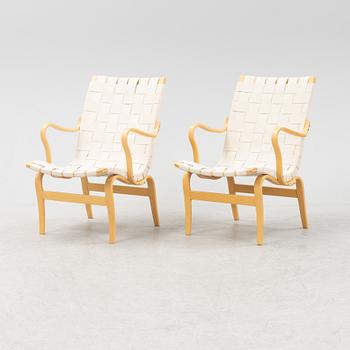 A pair of 'Eva' easy chairs by Bruno Mathsson, for Bruno Mathsson International, dated 2009.