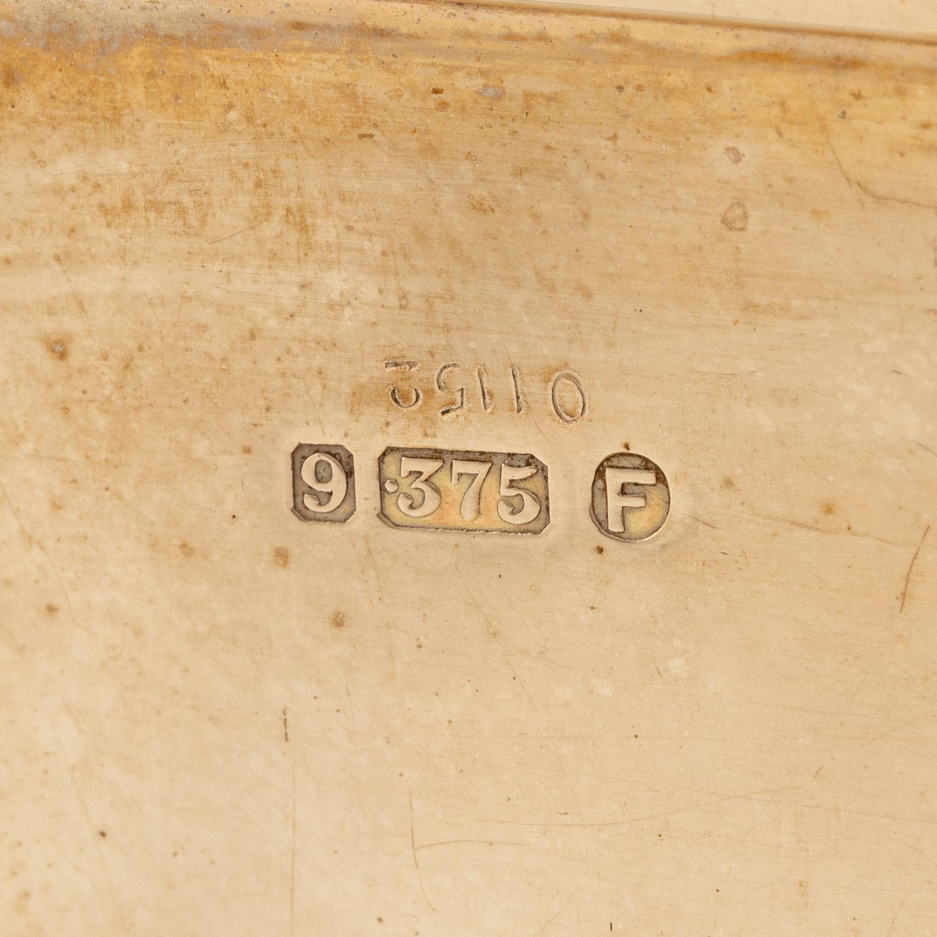 A Cartier 9 carat gold and calibré-cut sapphires cigarette case, London.