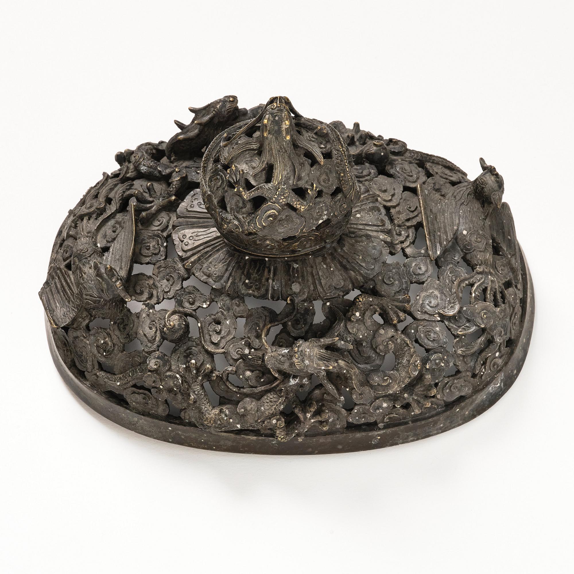 A bronze reticulated incense burner with cover, Qing dynasty (1644-1912).
