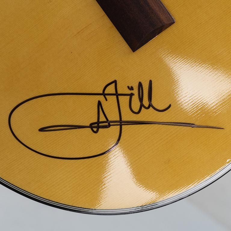 Jill Johnson, a signed acoustic guitar.