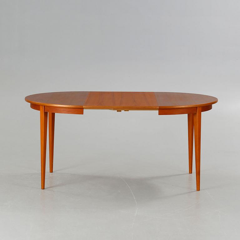 A dining table made in the middle of the 20th century.