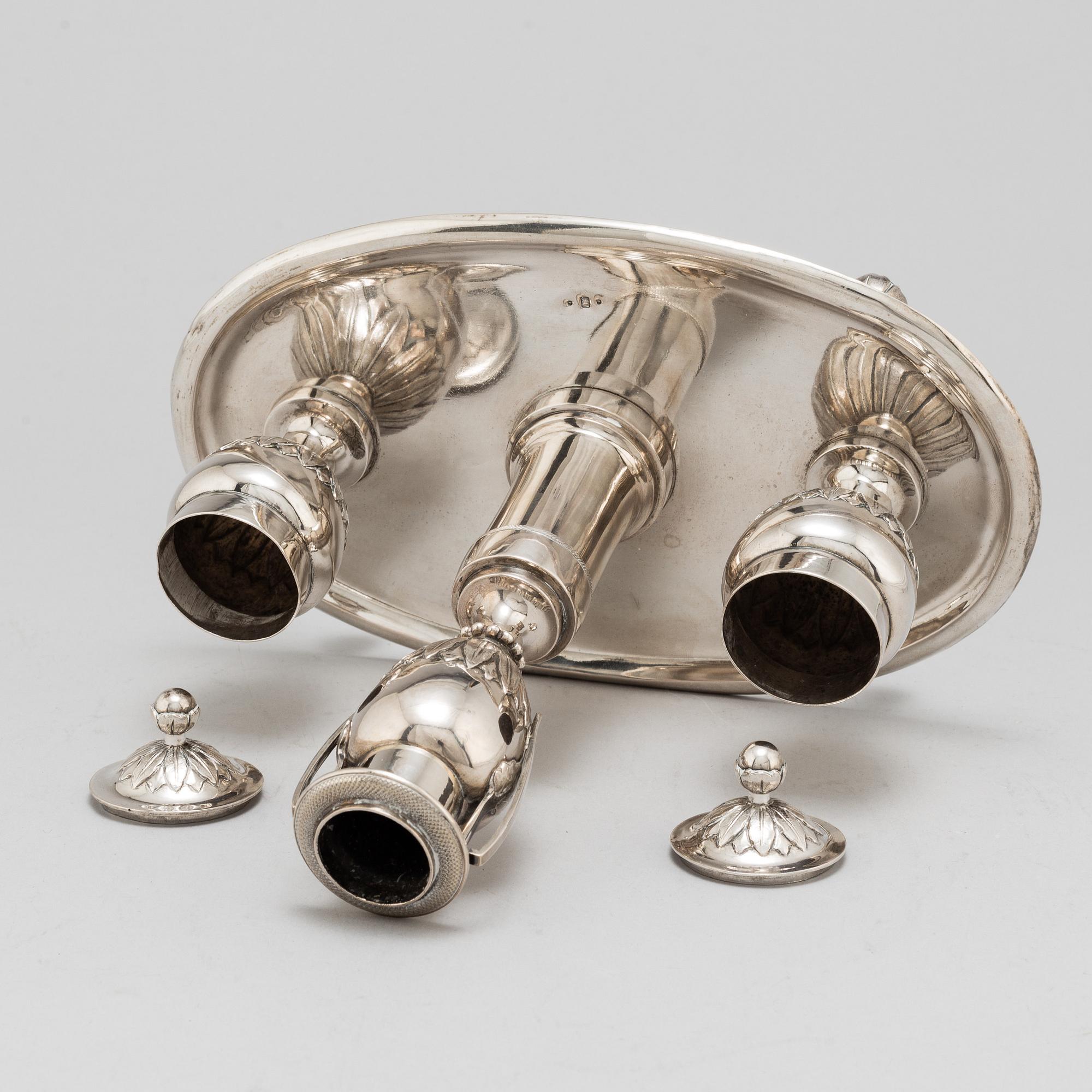 A 19th Century silver inkwell with candle holder.