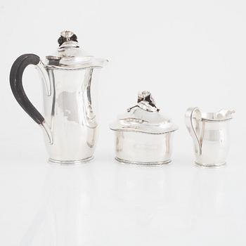 A Swedish Silver Coffee Pot, Creamer and Sugar Bowl, mark of Carl Fredrik Carlman, Stockholm 1951-54.