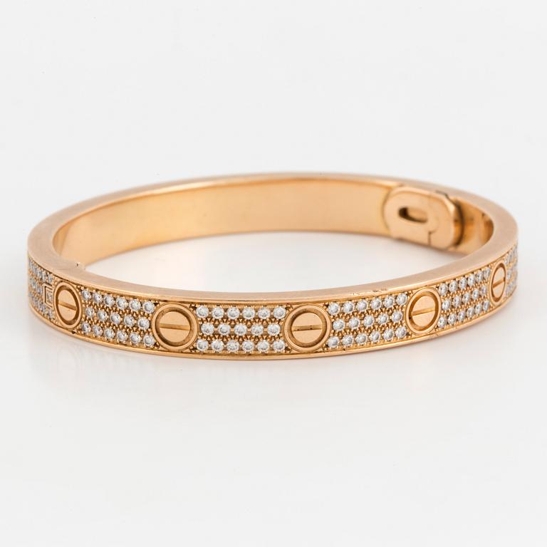 A Cartier 'LOVE' bangle set with round, brilliant-cut diamonds.