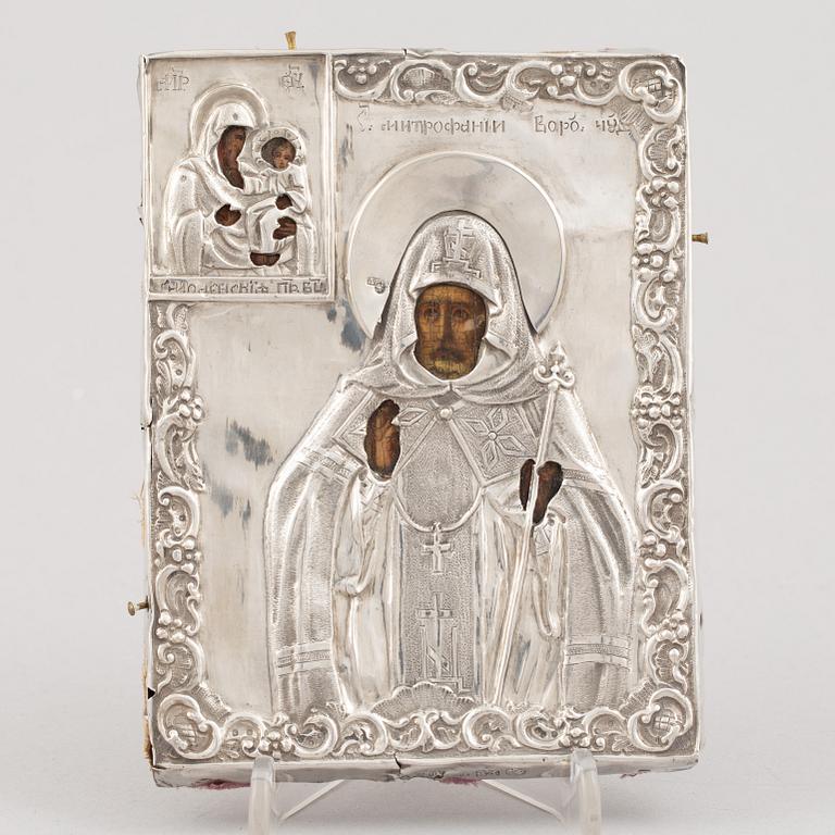 A Russian icon, with silver oklad, DN Dubinin (active 1849-54), St Petersburg.