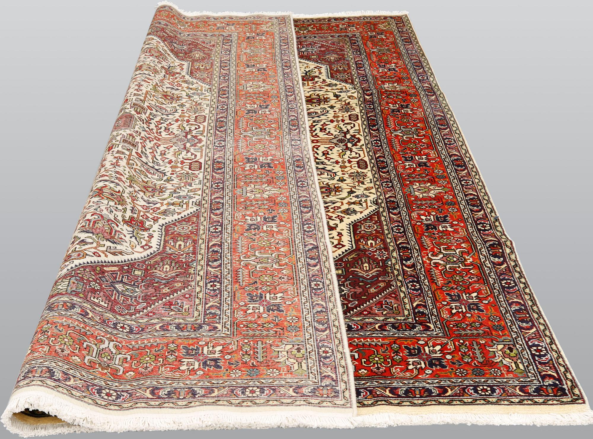 A Tabriz carpet, approximately 298 x 198 cm.