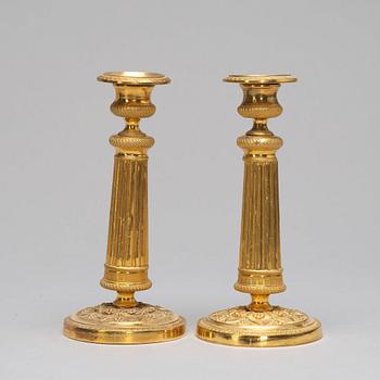 A pair of Empire-style candlesticks, ca 1900.