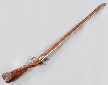 A flintlock rifle, 18th century.