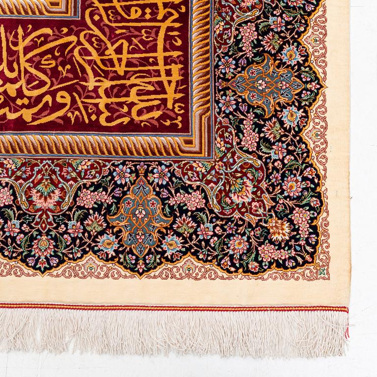 An extremely fine signed silk Qum rug, central Iran, c. 220 x 140 cm.