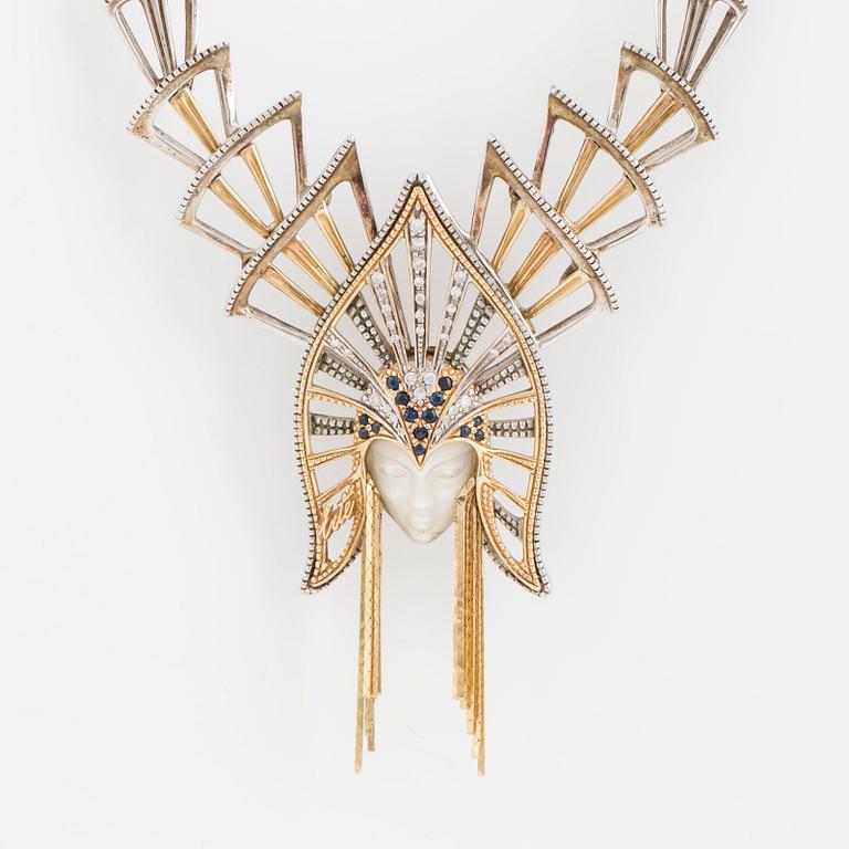 An ERTE necklace with a detachable pendant wearble as a brooch.