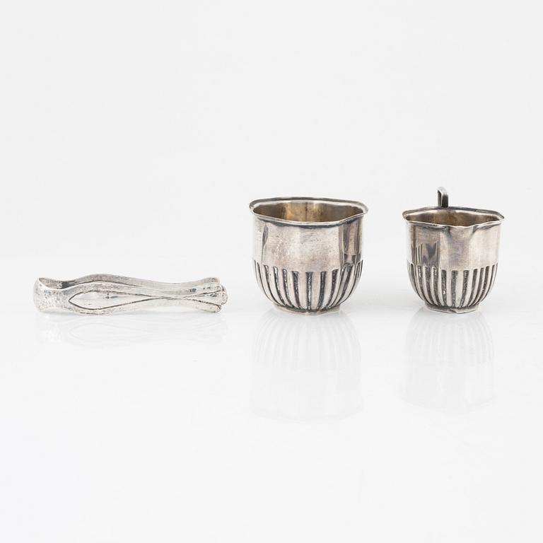 Creamer, sugar bowl, and sugar tongs, silver.