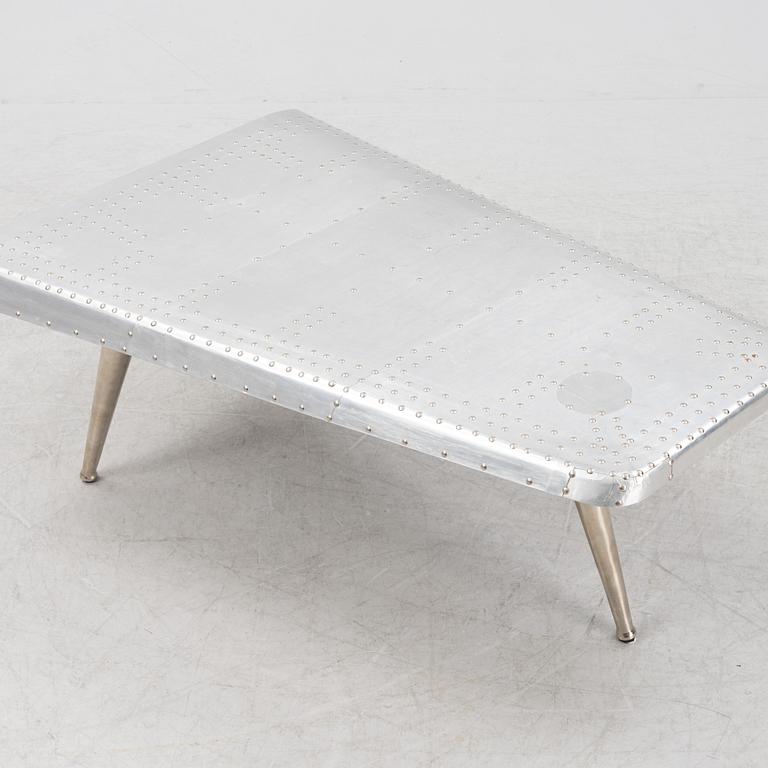 A coffee table constructed by a plane wing, second half of the 20th Century.