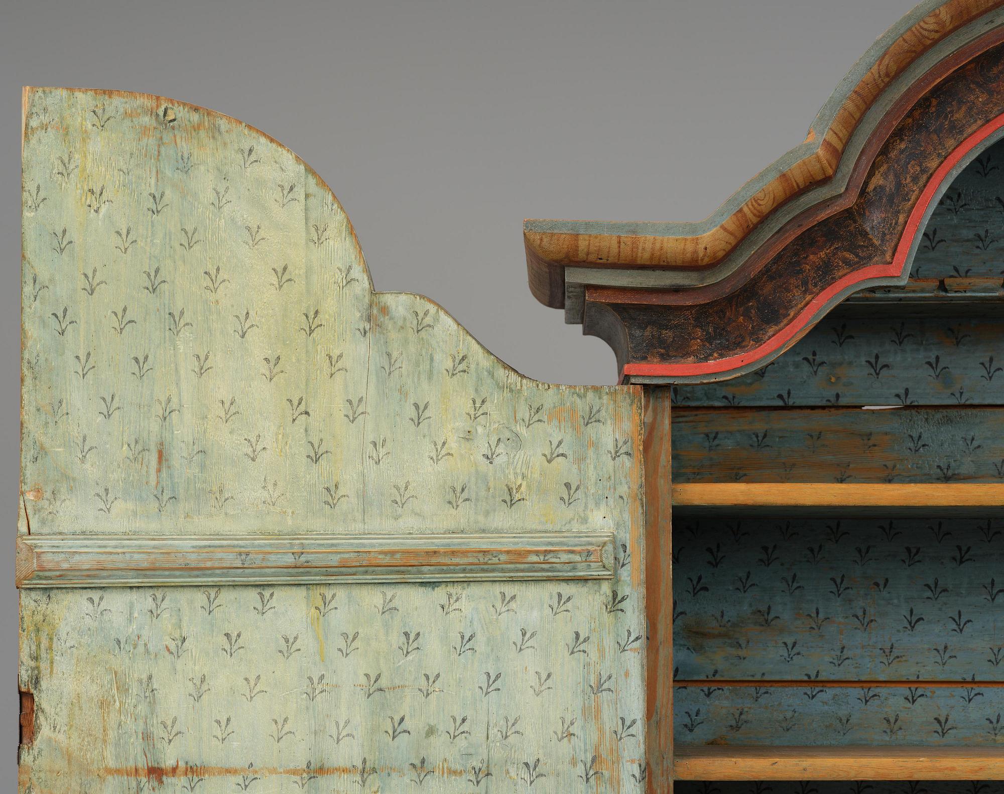 A polychrome-painted folk art cabinet from Värmland, Sweden, dated 1818.
