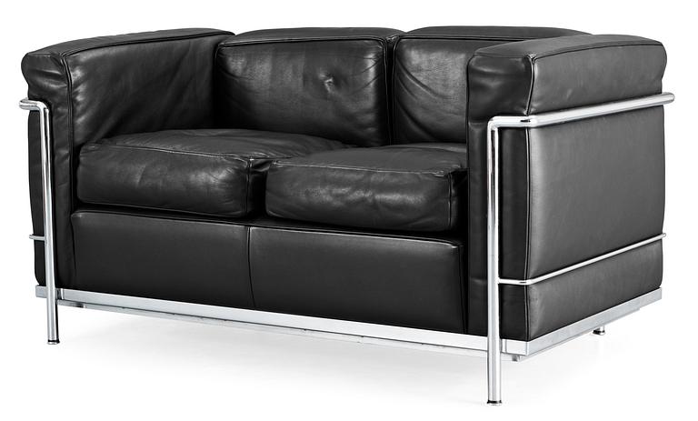 A Le Corbusier 'LC 2' two-seated black leather and chromed steel sofa, by Cassina, Italy.