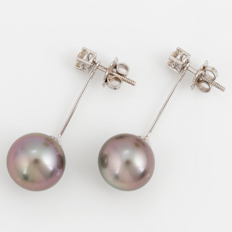 A pair of cultured Tahiti pearl and brilliant-cut diamond earrings.