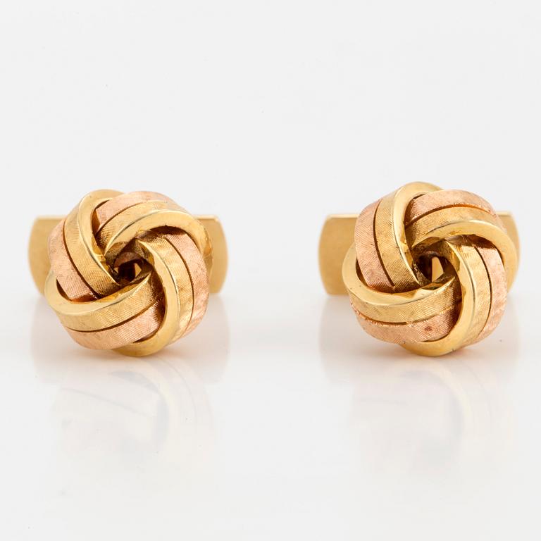 A pair of 18K two colour gold cufflinks.