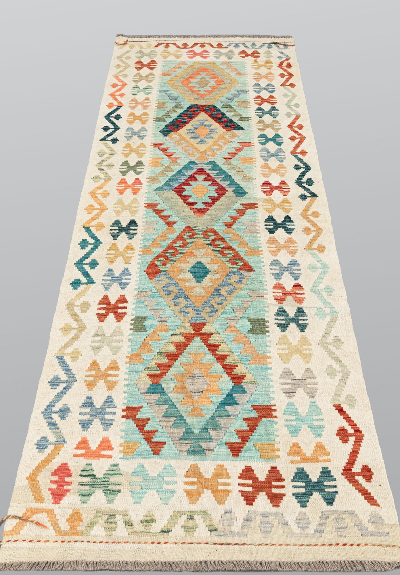 A Kilim runner, approx. 294 x 91 cm.