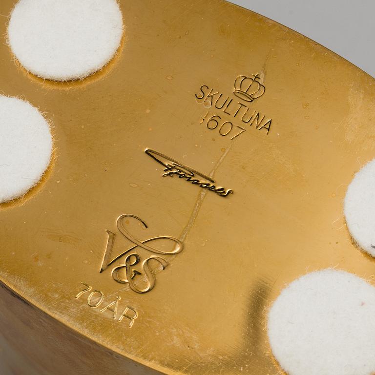 PIERRE FORSSELL, six gilt brass cups and a bottle, as well as candle holder, from Skultuna Bruk.