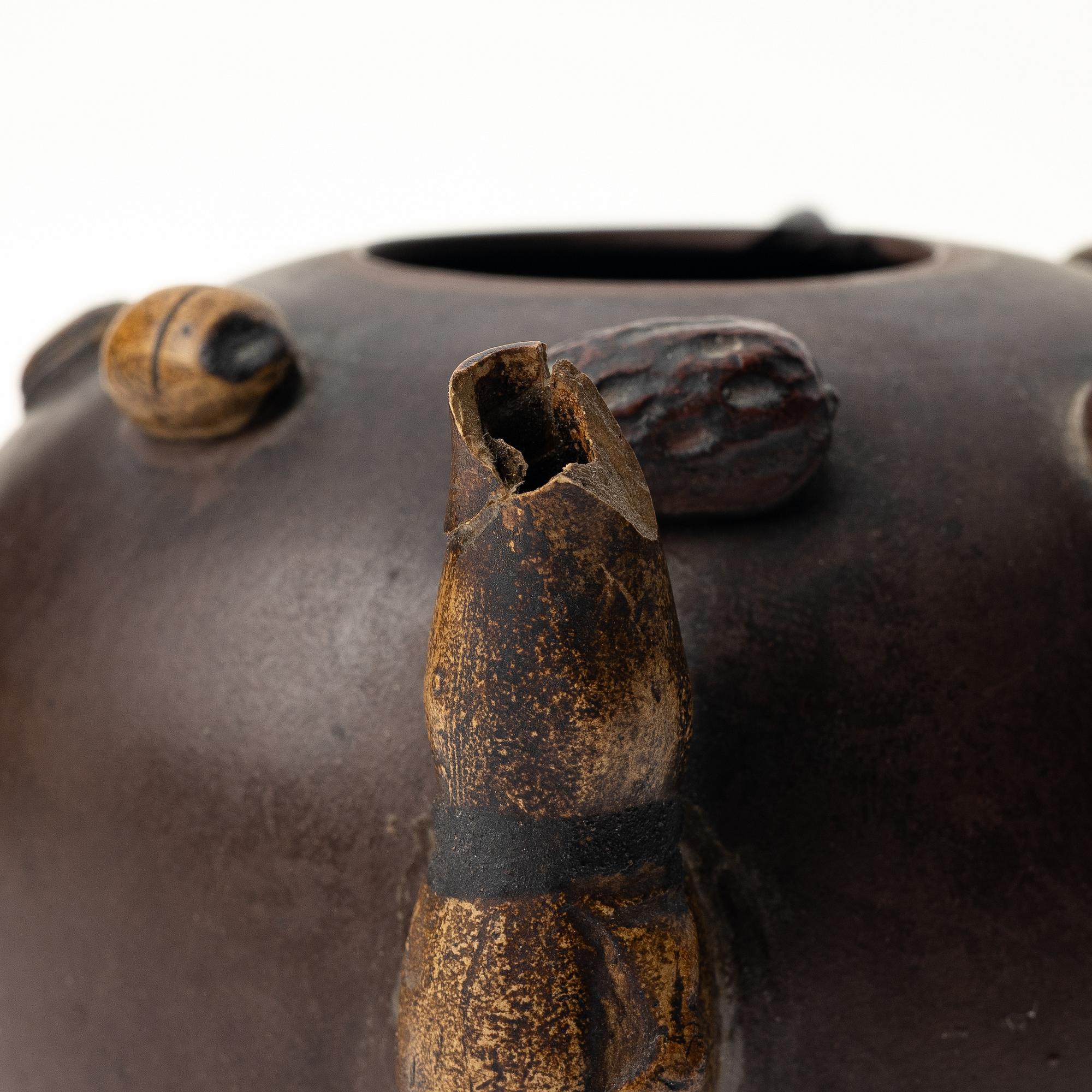 A Chinese 'hundred-fruit' yixing teapot, Qing dynasty (1644-1912).