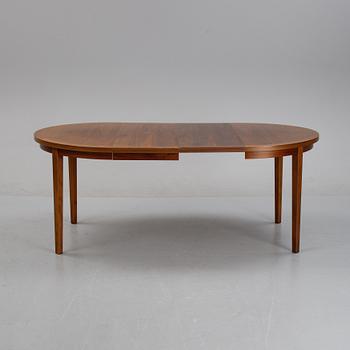 A mahogany veneer dining table, second half of the 20th century.