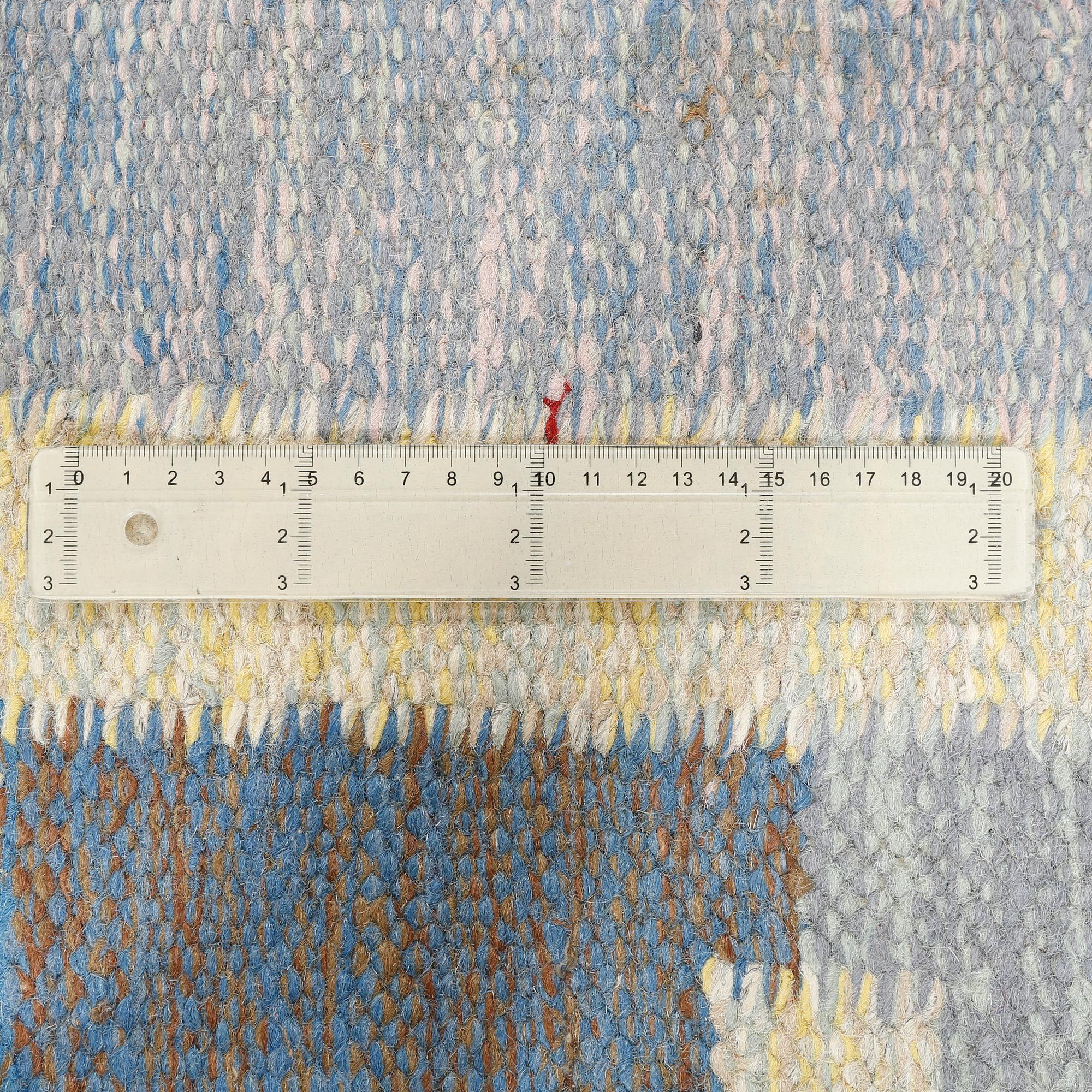 A flat weave carpet designed by Ida Rydelius from the second half of the 20th century.
