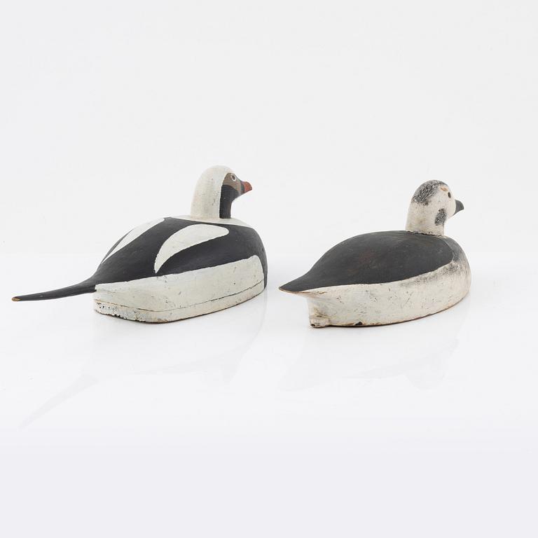 Two wooden decoy ducks, signed Eric Österman 1916.