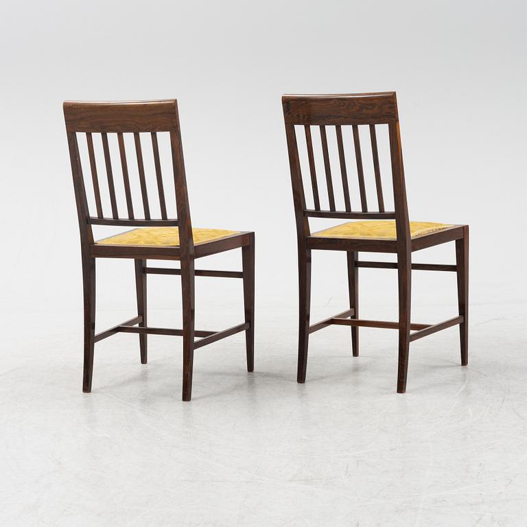 A group of five rosewood veneered chairs and a stool, mid 20th Century.