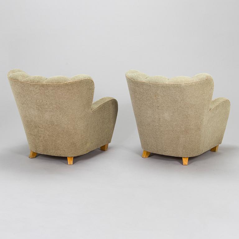 A pair of mid-20th century armchairs.