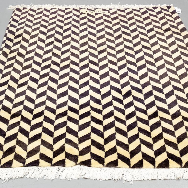 A persian rug, around 230 x 149 cm.