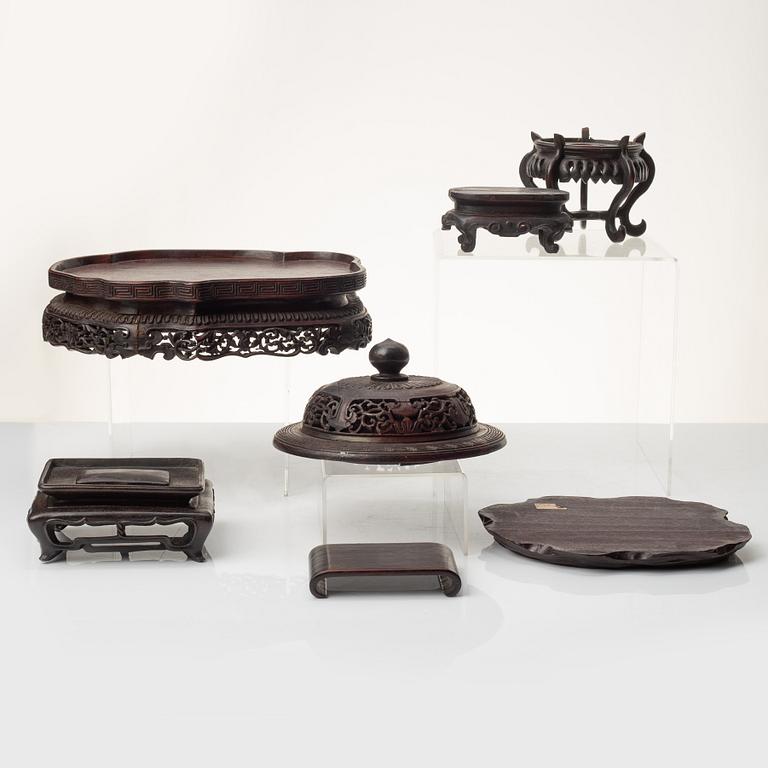 A group of Chinese hardwood stands and a cover, Qing dynasty and later.
