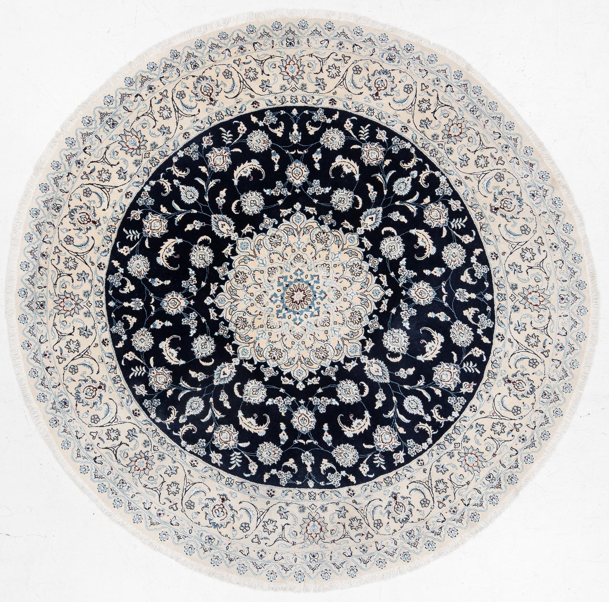 A Nain rug, diameter 243 cm.