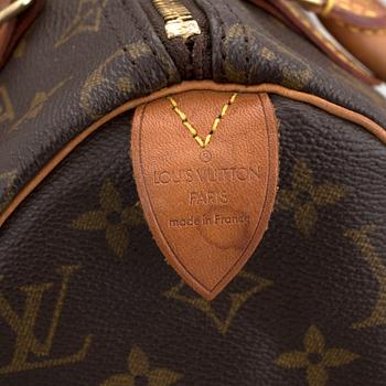 A Louis Vuitton "Speedy 25" hand bag.