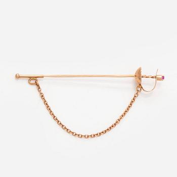 Tie pin, sword,  in 14K gold with a synthetic spinel. Soviet Union, late 20th century.