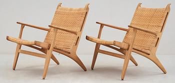 A pair of Hans J Wegner oak and rattan 'CH-27' armchairs, Carl Hansen & Søn, 1950's.