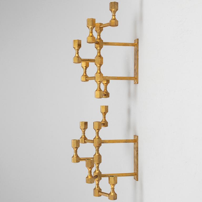 A pair of brass wall candelabras, for Gusum, signed BK and dated 1995 and 1997.
