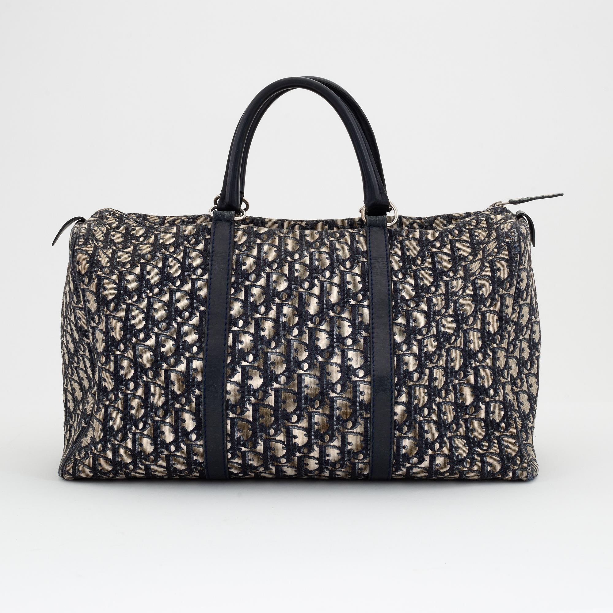 Christian Dior, a canvas handbag, toilet bag and key holder.