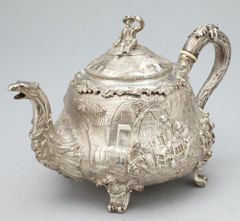 An English 19th century parcel-gilt tea-pot, marks of John Samuel Hunt, London 1849.