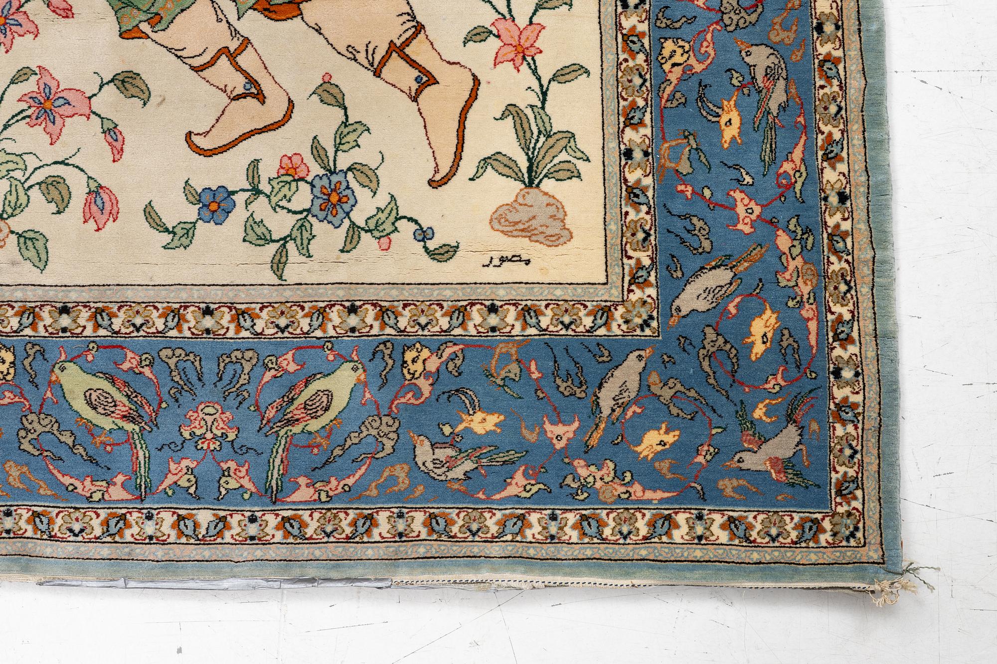 An Isfahan, figural rug, signed, c. 172 x 109 cm.