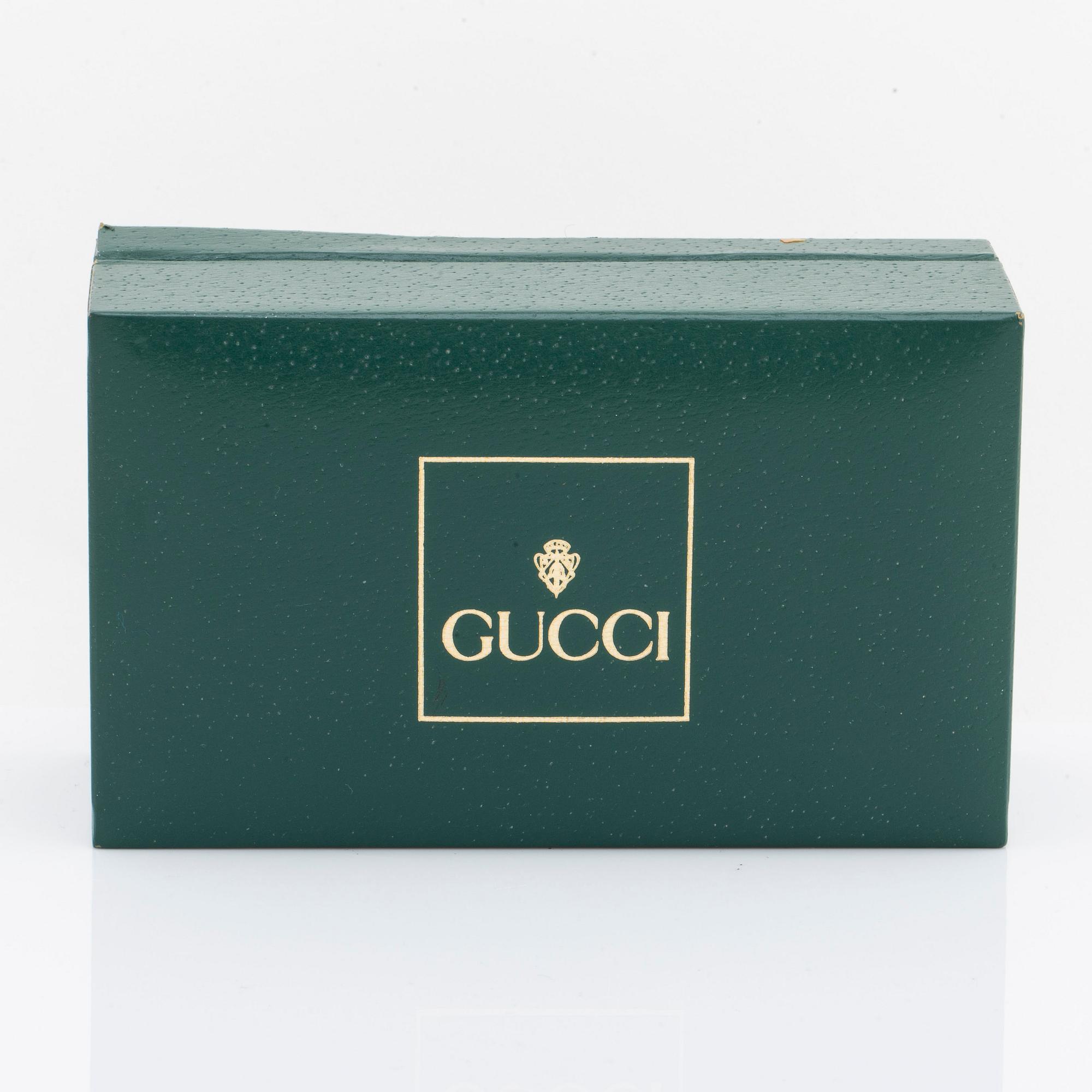 GUCCI wristwatch 23 mm w interchangable rings of plastic, quartz movement, original box.