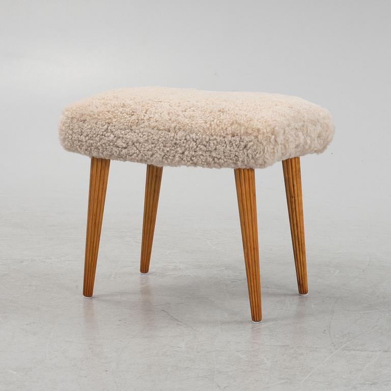 A sheepskin upholstered stool, mid 20th Century.